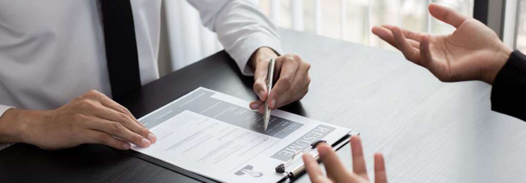 HR head is reading the resume and information about the candidates history